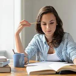 Woman studying with improved focus and concentration - cognitive benefits of bioavailable curcumin